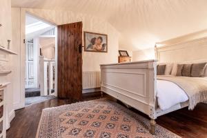 Łóżko lub łóżka w pokoju w obiekcie Quadrant Cottage