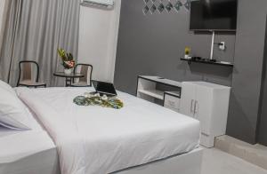 En eller flere senge i et værelse på BIN DAOD Hotel Syariah