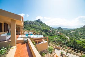 a villa with a view of the mountains at VILLA ALOE in Costa Paradiso