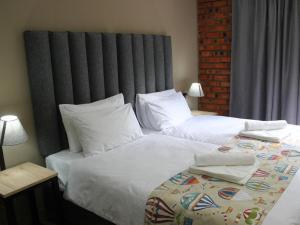 Ένα ή περισσότερα κρεβάτια σε δωμάτιο στο AN Boutique Hotel