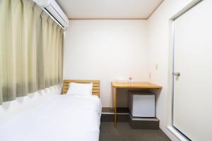Tabist Hotel Daimu Minami-Souma客房内的一张或多张床位