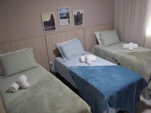 מיטה או מיטות בחדר ב-Pousada Marlin Azul