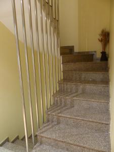 a set of stairs with a metal railing at Hotel Les Truites Adults only in Pas de la Casa