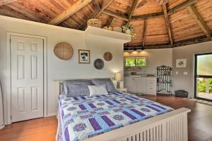 a bedroom with a large bed in a room with wooden ceilings at Hilo Couples Retreat about 6 Miles to Honolii Beach! in Hilo