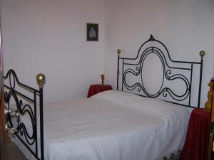 Giường trong phòng chung tại Appartamentino Panoramico
