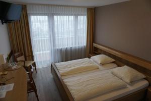 Ein Bett oder Betten in einem Zimmer der Unterkunft B&B Ruthmann-Rheinblick
