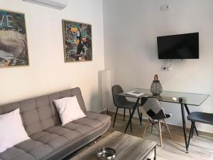 a living room with a couch and a table at Home SEA&DREAMS OldTown I in Calpe