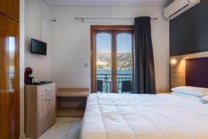 Posteľ alebo postele v izbe v ubytovaní Hotel Aggelos Kefalonia