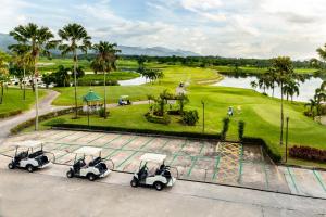an aerial view of a golf course with golf carts at Pattana Sports Resort in Si Racha