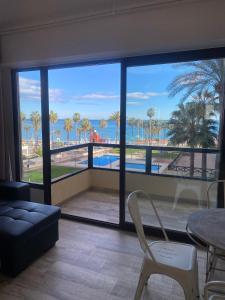 a living room with a view of the ocean at Aloha Playa in Benalmádena