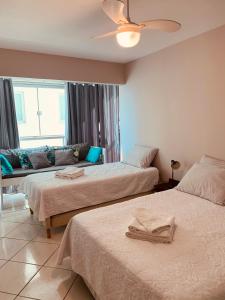 Кровать или кровати в номере Apartamento beira-mar em Balneário Camboriú