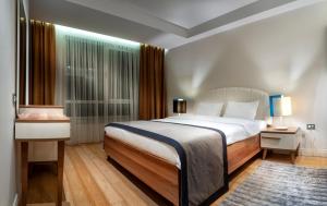 Postel nebo postele na pokoji v ubytování Armoni Residence Istanbul