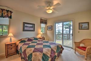 a bedroom with a bed and a ceiling fan at Waterfront Hammond Home with Grill and Boat Dock! in Hammond