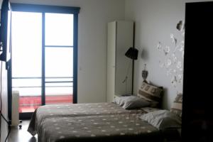 Postel nebo postele na pokoji v ubytování Madeira Native Motion Guest House