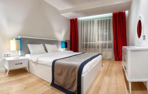 Postel nebo postele na pokoji v ubytování Armoni Residence Istanbul
