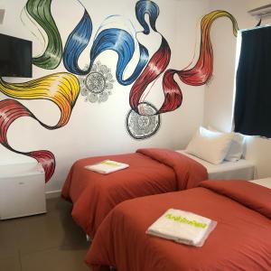 Uma cama ou camas num quarto em Anhembi Hostel