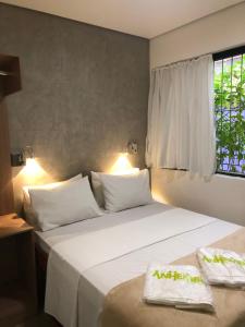 Postel nebo postele na pokoji v ubytování Anhembi Hostel