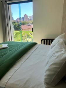 Postel nebo postele na pokoji v ubytování Anhembi Hostel