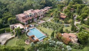 an aerial view of a mansion with a swimming pool at La Toscana in Suan Phung