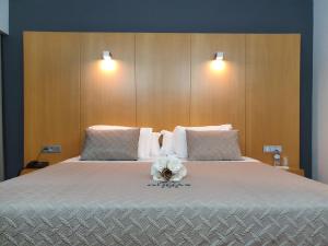 Postel nebo postele na pokoji v ubytování Hotel Dunas d'Ovar