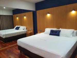 Postel nebo postele na pokoji v ubytování Hotel Dunas d'Ovar