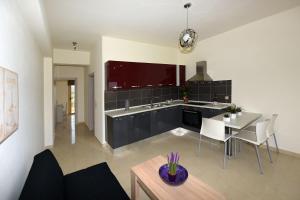 A kitchen or kitchenette at Stelia Luxury apartments