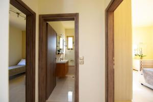 A bed or beds in a room at Stelia Luxury apartments