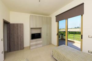 A television and/or entertainment centre at Stelia Luxury apartments