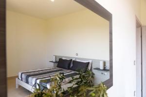 A bed or beds in a room at Stelia Luxury apartments