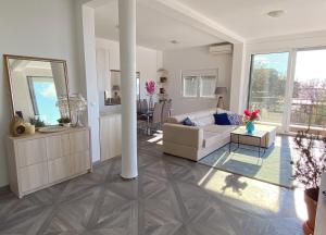 a living room with a couch and a table at Villa Casanego in Sutomore