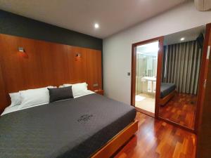 Postel nebo postele na pokoji v ubytování Hotel Dunas d'Ovar