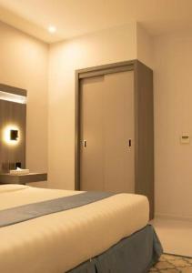 Łóżko lub łóżka w pokoju w obiekcie Manazeli Jeddah -