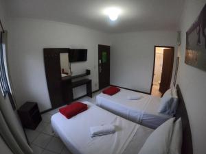 Cama ou camas em um quarto em Che Lagarto Paraty