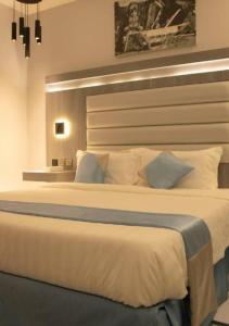 Cama o camas de una habitación en Manazeli Jeddah -
