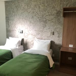 Postel nebo postele na pokoji v ubytování Anhembi Hostel