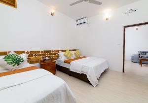 A bed or beds in a room at Quicksand Rasdhoo