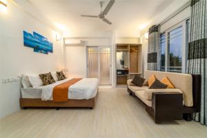 A bed or beds in a room at Quicksand Rasdhoo