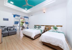 A bed or beds in a room at Quicksand Rasdhoo