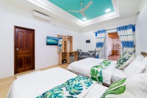 A bed or beds in a room at Quicksand Rasdhoo