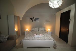 A bed or beds in a room at Guest House Orsini