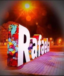 a large white sign that says art on a sidewalk at COMPLEJO DE VARIOS LOFT EN RAFAELA A 100 METROS de la RUTA 34 in Rafaela