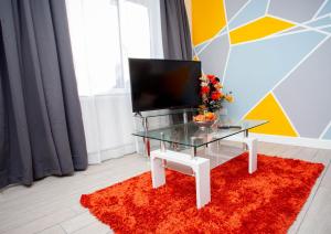 TV a/nebo společenská místnost v ubytování Oasis Place