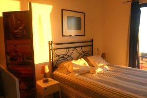 Postel nebo postele na pokoji v ubytování Madeira Native Motion Guest House