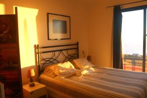 Postel nebo postele na pokoji v ubytování Madeira Native Motion Guest House
