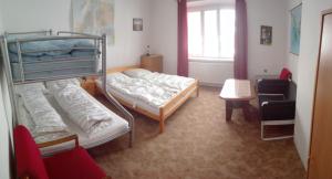 Postel nebo postele na pokoji v ubytování Apartmán Saxán Smržovka