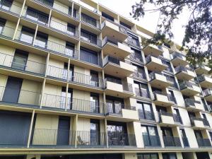 an apartment building with balconies on the side of it at Cosy Park Apartment City Center in Vienna