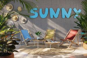 a group of chairs and a sign that reads summer at Rubin Hotel in Poreč