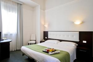 Postel nebo postele na pokoji v ubytování Dipendenza Hotel Bellavista