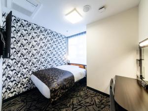 Letto o letti in una camera di APA Hotel Kyoto Gion Excellent