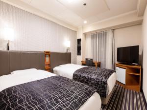 Letto o letti in una camera di APA Hotel Kyoto Gion Excellent